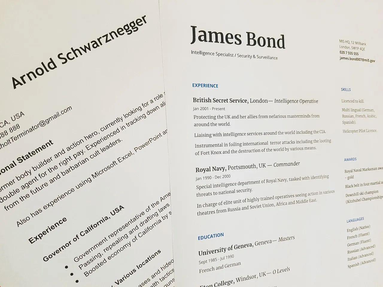 Close-up photo of two humorous fictional resumes featuring Arnold Schwarzenegger and James Bond, showcasing playful personal statements, exaggerated skills, and imaginary job experiences related to their iconic movie roles; ideal for creative writing, entertainment, or resume parody concepts.