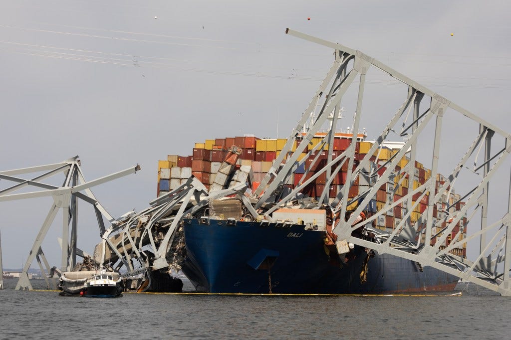 Wreckage from the collapsed Francis Scott Key Bridge rests on the Dali cargo ship as efforts begin to clear the debris and reopen the Port of Baltimore on March 30. Wreckage from the collapsed Francis Scott Key Bridge rests on the Dali cargo ship as efforts begin to clear the debris and reopen the Port of Baltimore on March 30.