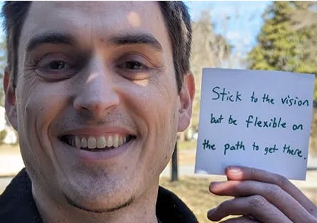 Ryan holding sign Ryan holding sign