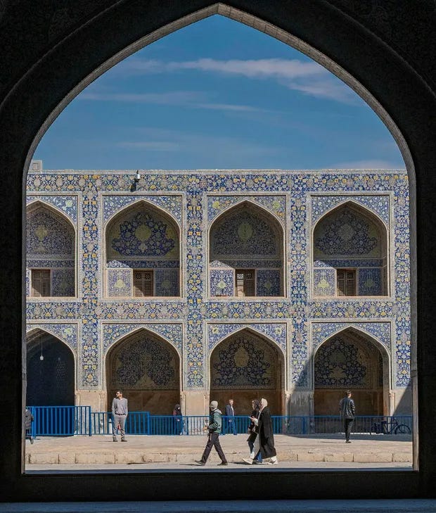 The entrance to the Shah Mosque, a defining feature of Isfahan's architectural splendor.