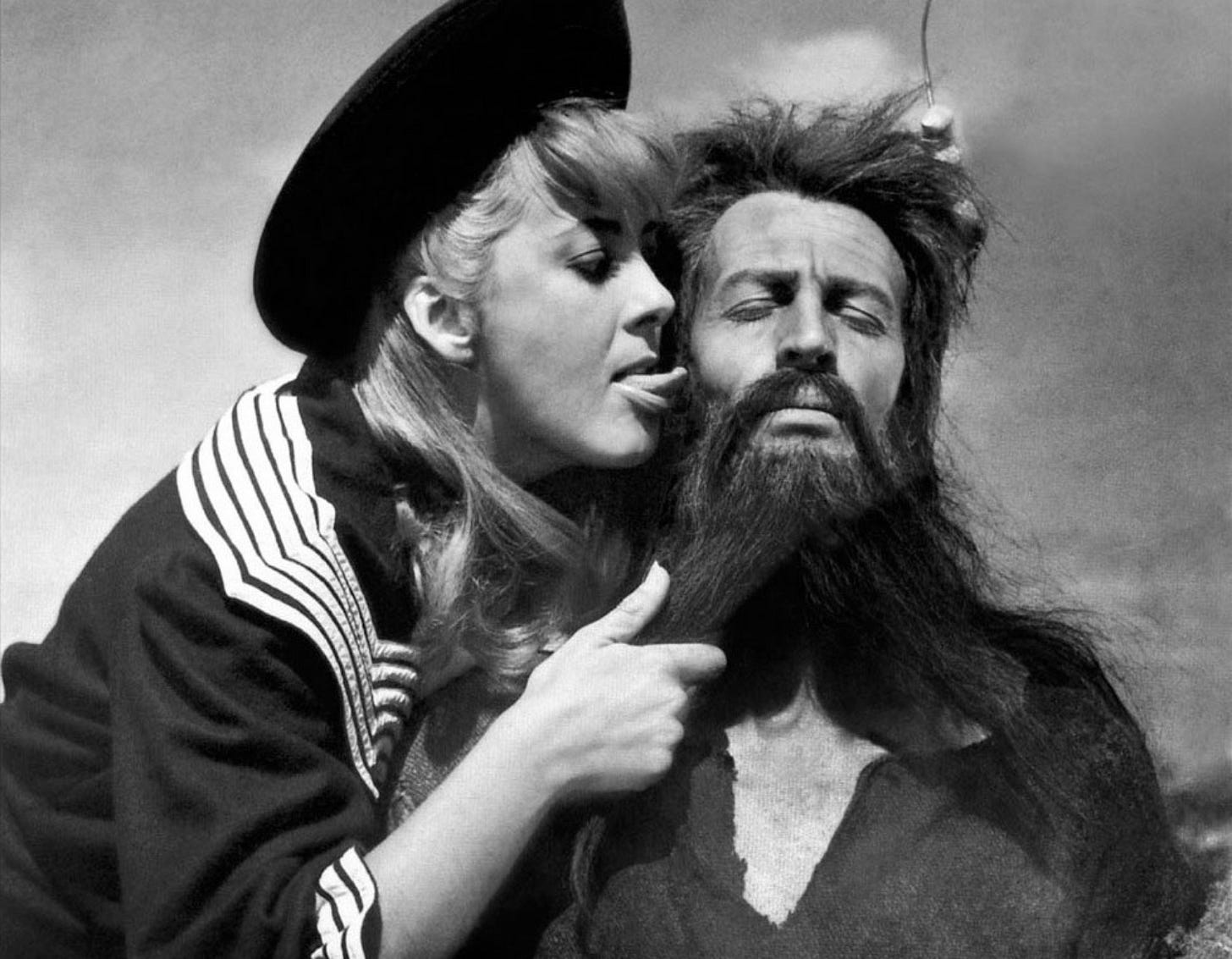 Black and white image with a young woman tormenting a hermit