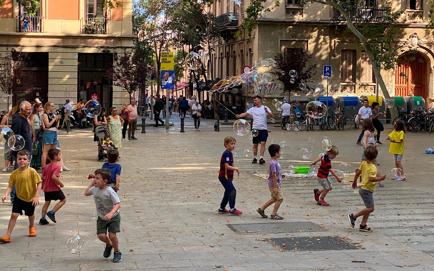 Children chasing bubbles