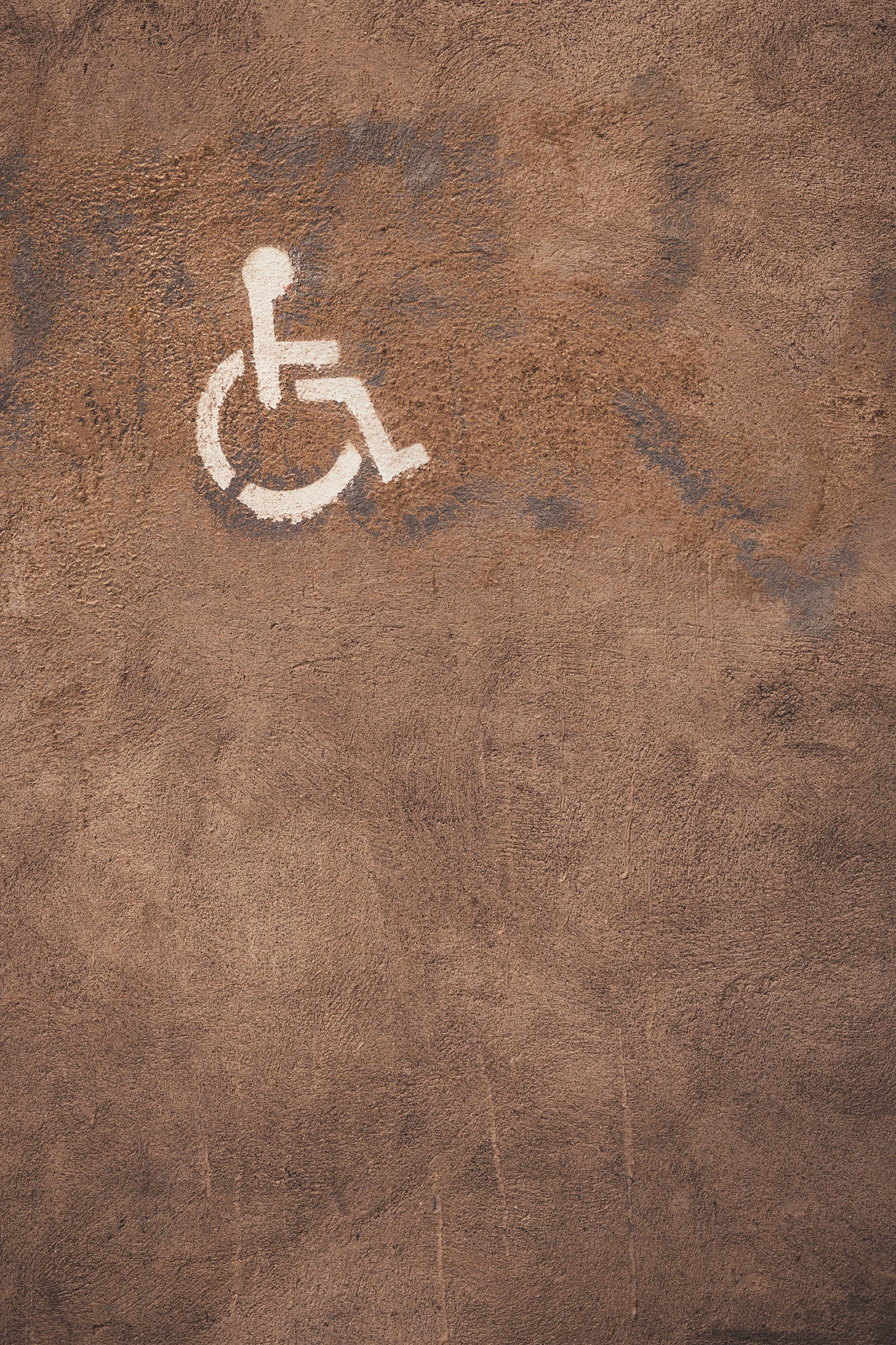 a handicap sign is painted on the ground a handicap sign is painted on the ground