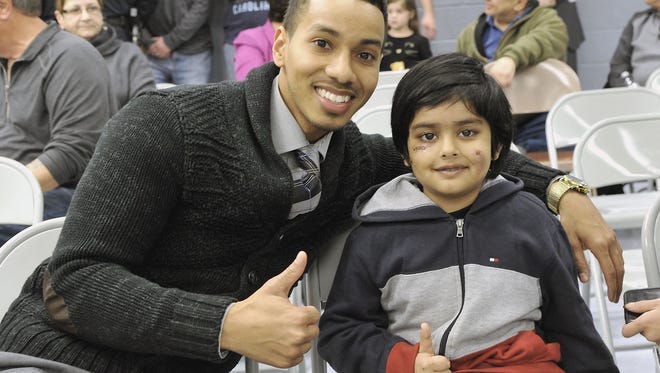 Danny Walls, left, saved 6-year-old Aryan Gavali as he was being attacked by a rabid raccoon in Elmwood Park in January.