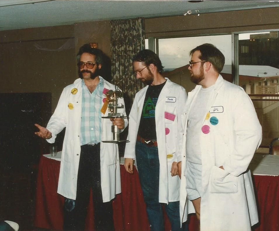 A vintage 1991 photo of Mad Scientist Club members wearing their standard uniform, a white lab coat. A vintage 1991 photo of Mad Scientist Club members wearing their standard uniform, a white lab coat.