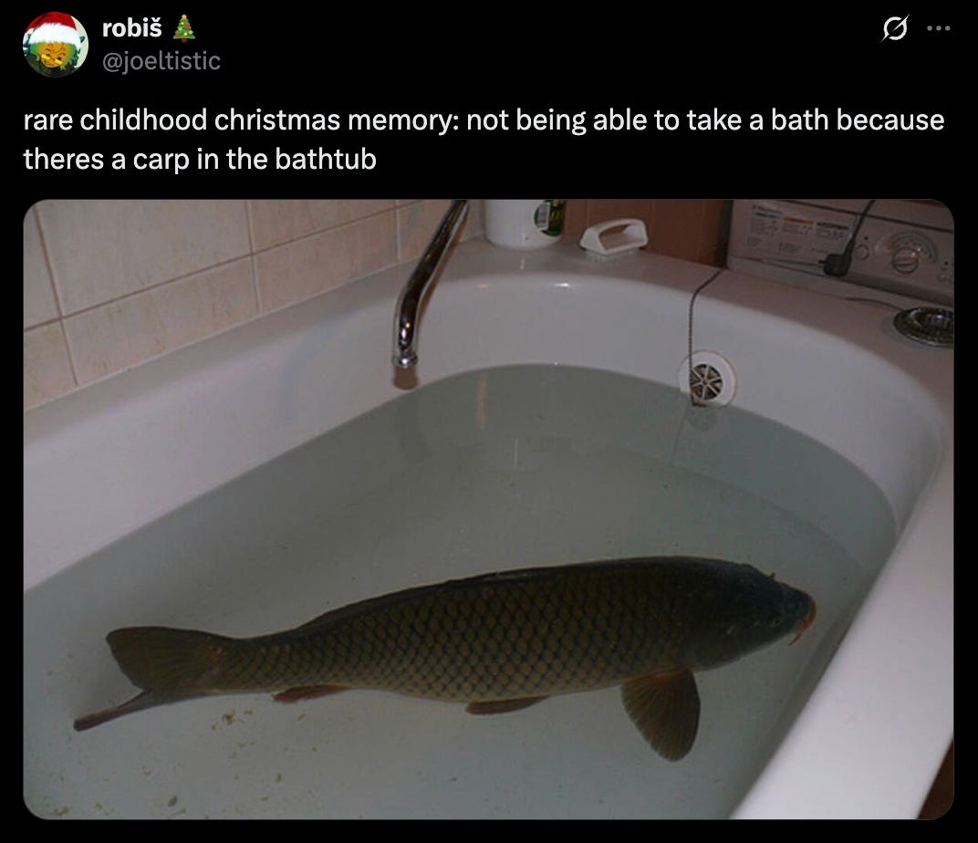 Tweet from @jeltistic that says "rare childhood christmas memory: not being able to take a bath because theres a carp in the bathtub" and features an image of a bathtub full of water with an extremely large carp in it