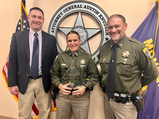 Trooper Armstrong (middle) with Attorney General Austin Knudsen and MHP Colonel Steve Lavin