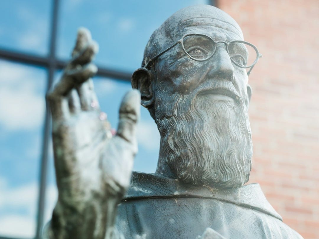 man in white shirt statue