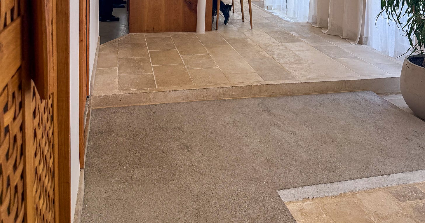 The stone-floored entrance with dried bay laurel and a paper-lined ceiling at Bittikesu, Paris 4th The stone-floored entrance with dried bay laurel and a paper-lined ceiling at Bittikesu, Paris 4th