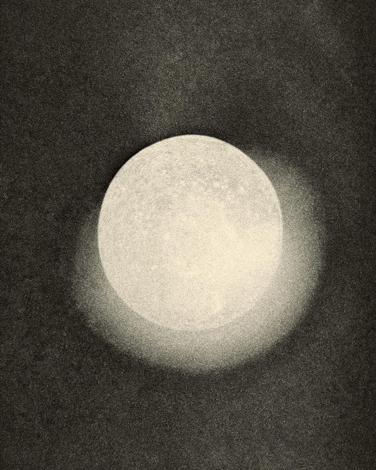 This may contain: the moon is shining brightly in the dark sky This may contain: the moon is shining brightly in the dark sky