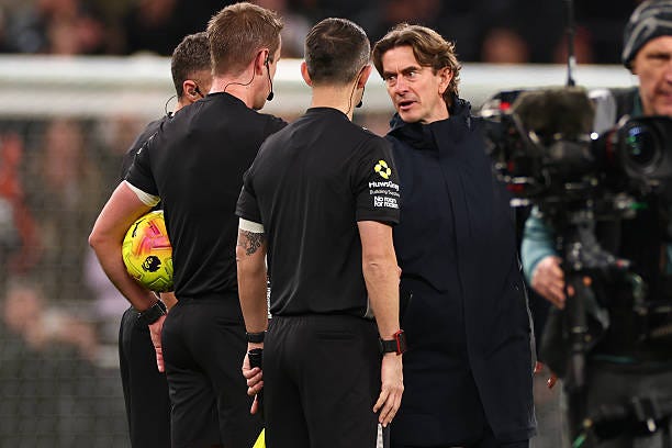 Tottenham Hotspur Manager Thomas Frank speaks to referee John Brooks during the Premier League match between Tottenham Hotspur and Liverpool at...