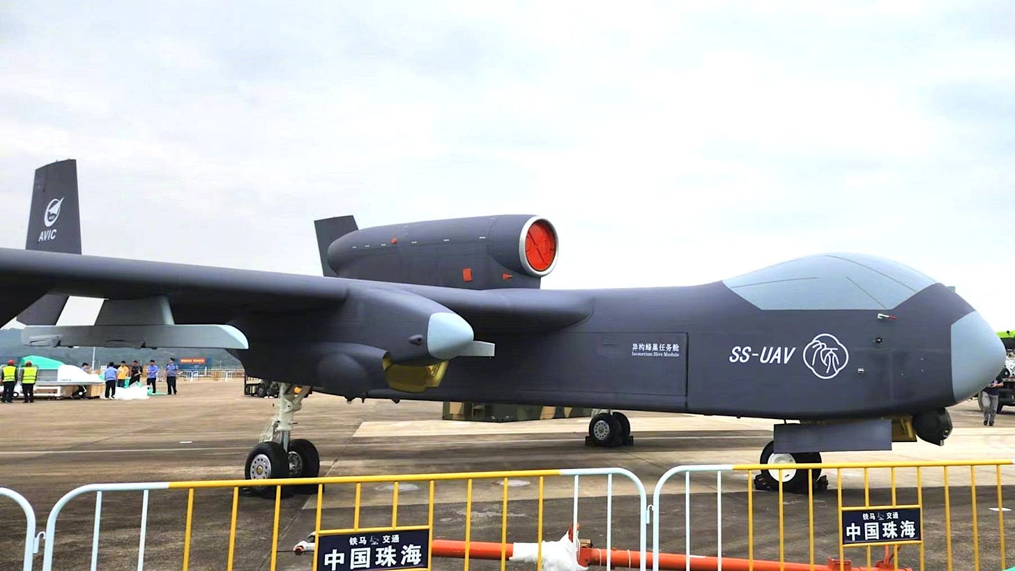 A new large jet-powered Chinese armed drone said to have a 10-ton maximum takeoff weight, or a mockup thereof, has emerged, and the design looks to be at least configurable to be a swarm mothership. A new large jet-powered Chinese armed drone said to have a 10-ton maximum takeoff weight, or a mockup thereof, has emerged, and the design looks to be at least configurable to be a swarm mothership.