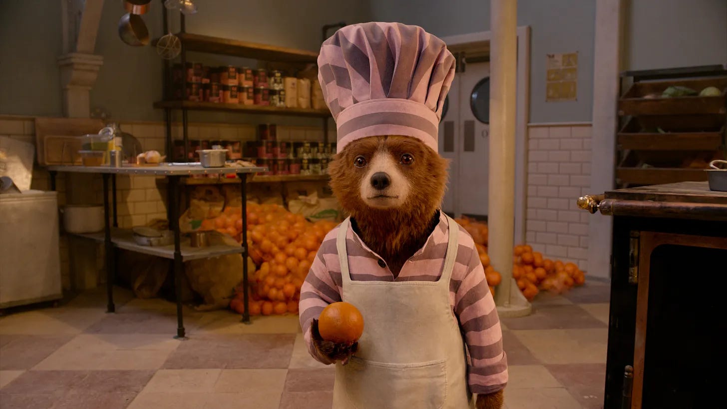 our good friend paddington bear holds an orange our good friend paddington bear holds an orange