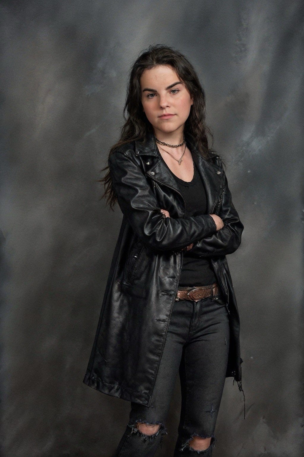 An AI-generated picture of myself as a young woman, playing the "bad girl" with a black jacket, t-shirt, and torn jeans.