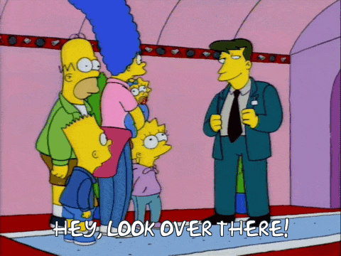 a cartoon of homer simpson and his family standing next to a man that says hey look over there