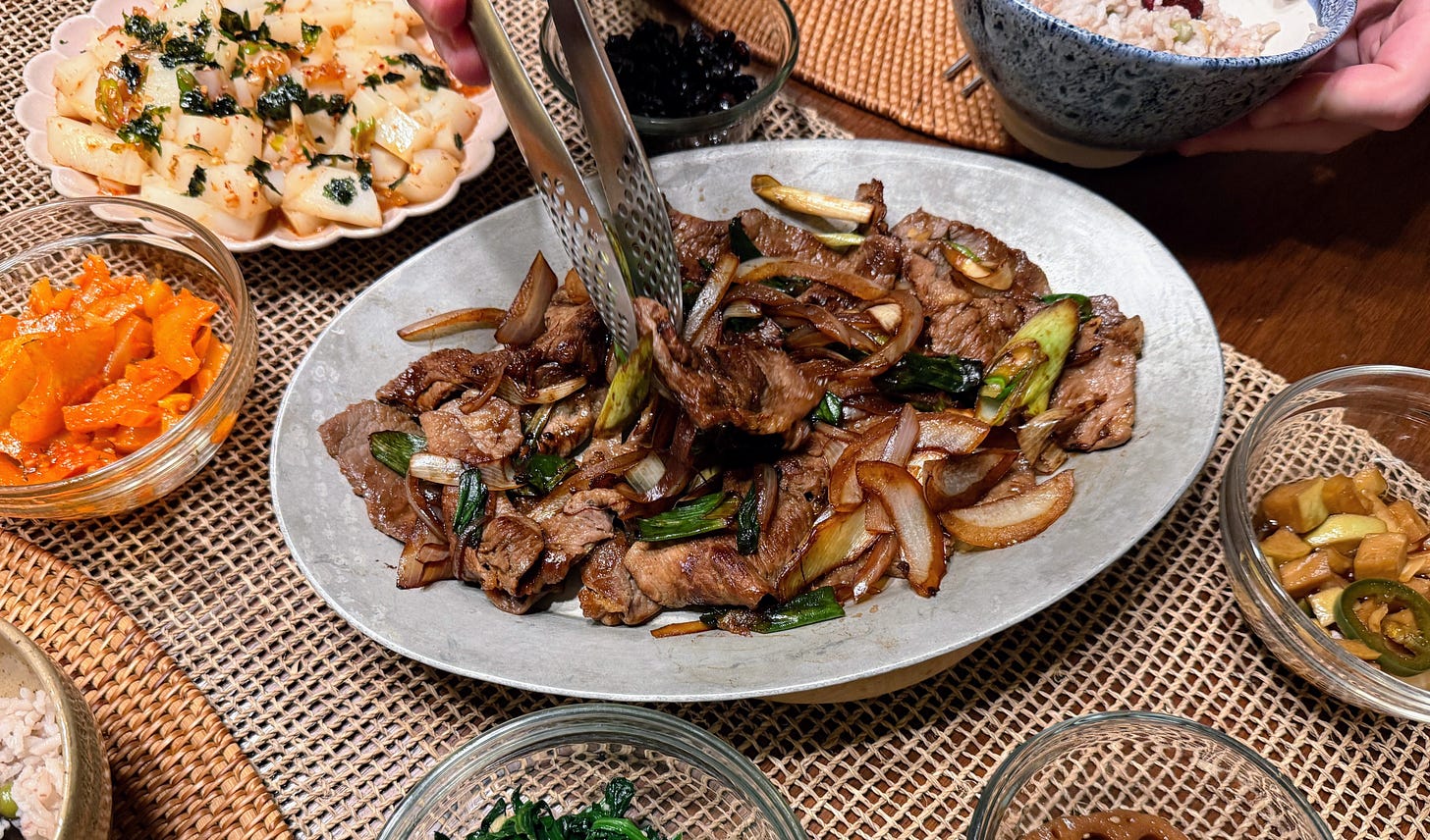 Bulgogi and banchan on dining table