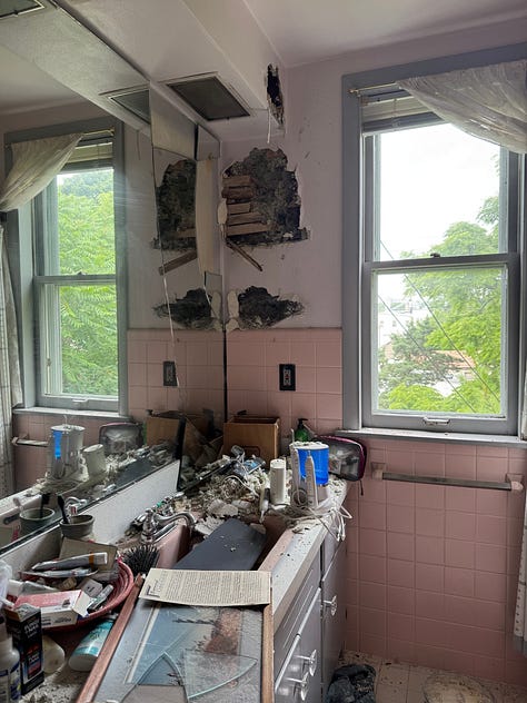 Six photos, three of interior fire damage, two of ongoing repairs, and one of a stack of flooring. 