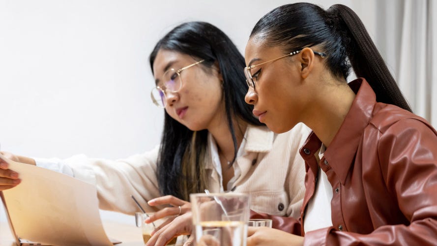 asian and Black colleagues working on a sales pipeline review