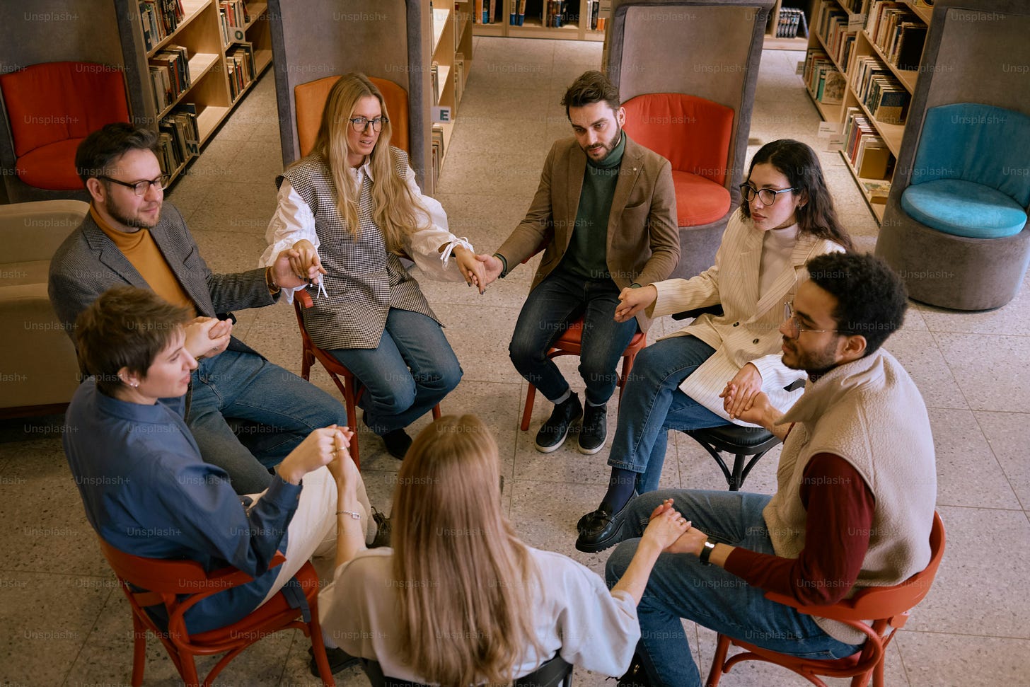 a group of people sitting around each other