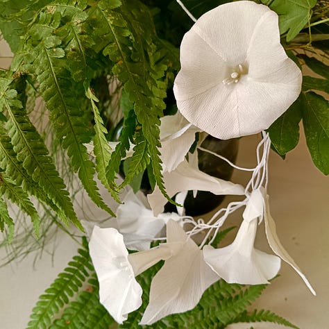 Bindweed trumpets in the morning sun with a visiting butterfly; paper bindweed photographed with real horsetail and ferns; an arrangement of bindweed, both real and paper, with an array of grasses and leaves collected from the hedgerows.