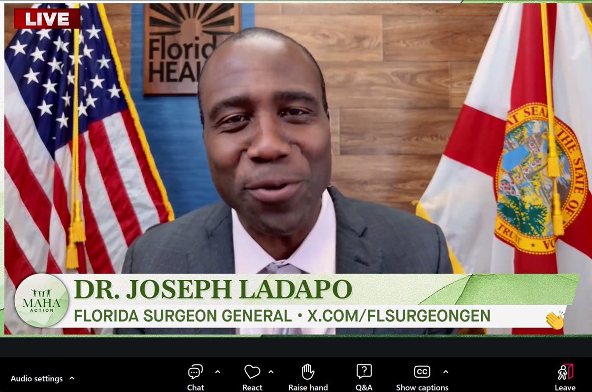 The image features Dr. Joseph Ladapo, the Florida Surgeon General, speaking on a platform, possibly during a press conference or live interview, with a backdrop of the Florida state flag and an American flag.

AI-generated content may be incorrect.