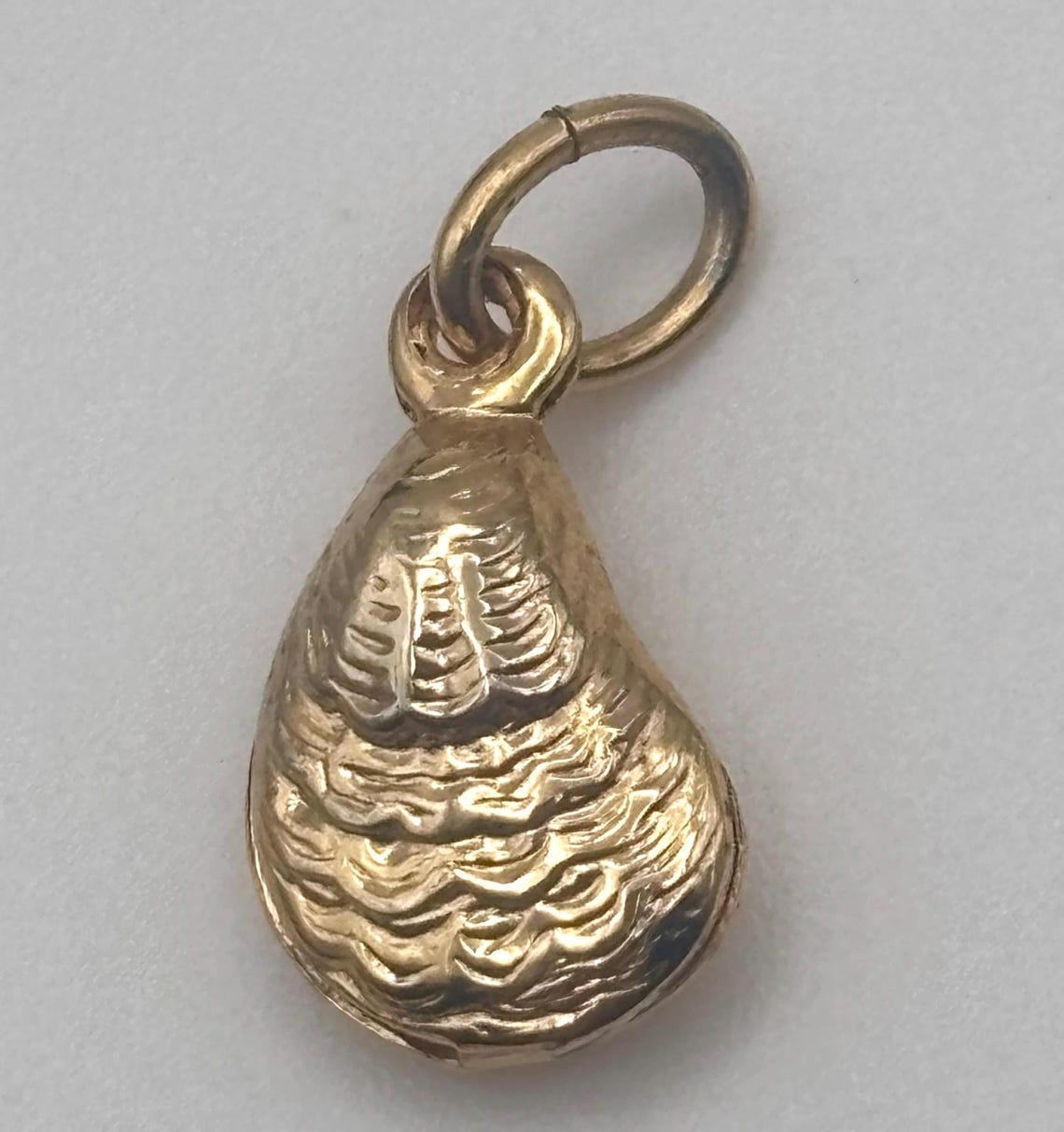 Vintage 80s Oyster Shell Charm Pendant Yellow Gold Tone Embossed 3-D Hollow image 1 Vintage 80s Oyster Shell Charm Pendant Yellow Gold Tone Embossed 3-D Hollow image 1