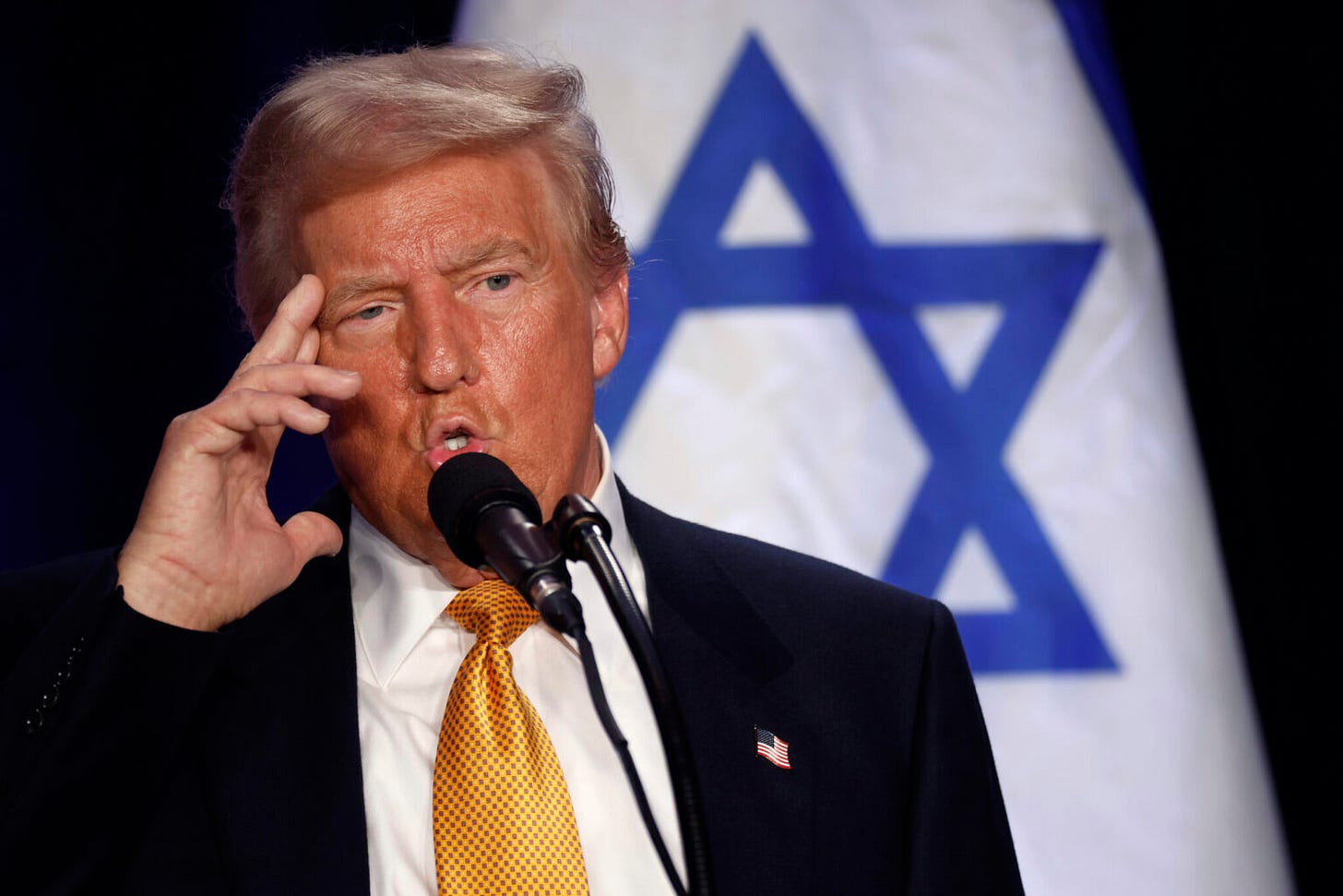 Trump in front of an Israeli flag