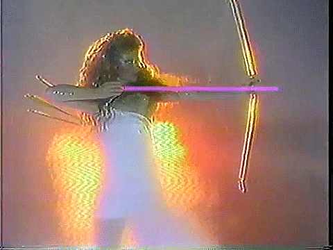 This may contain: the woman is holding two swords in her hands while she stands with one arm raised