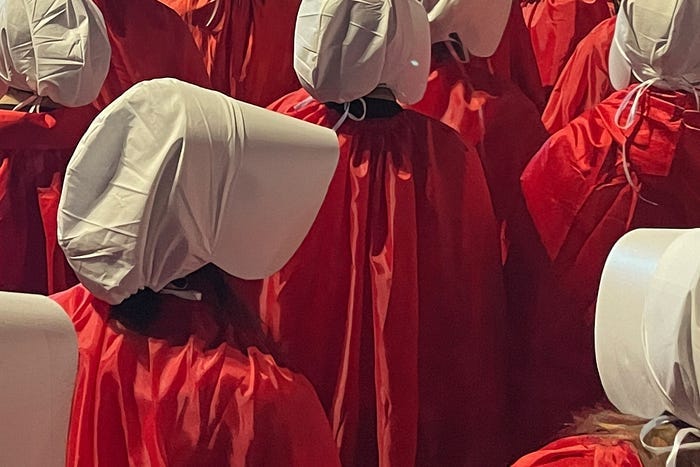 Women dressed as a Handmaid from The Handmaid’s Tale March 11, 2023