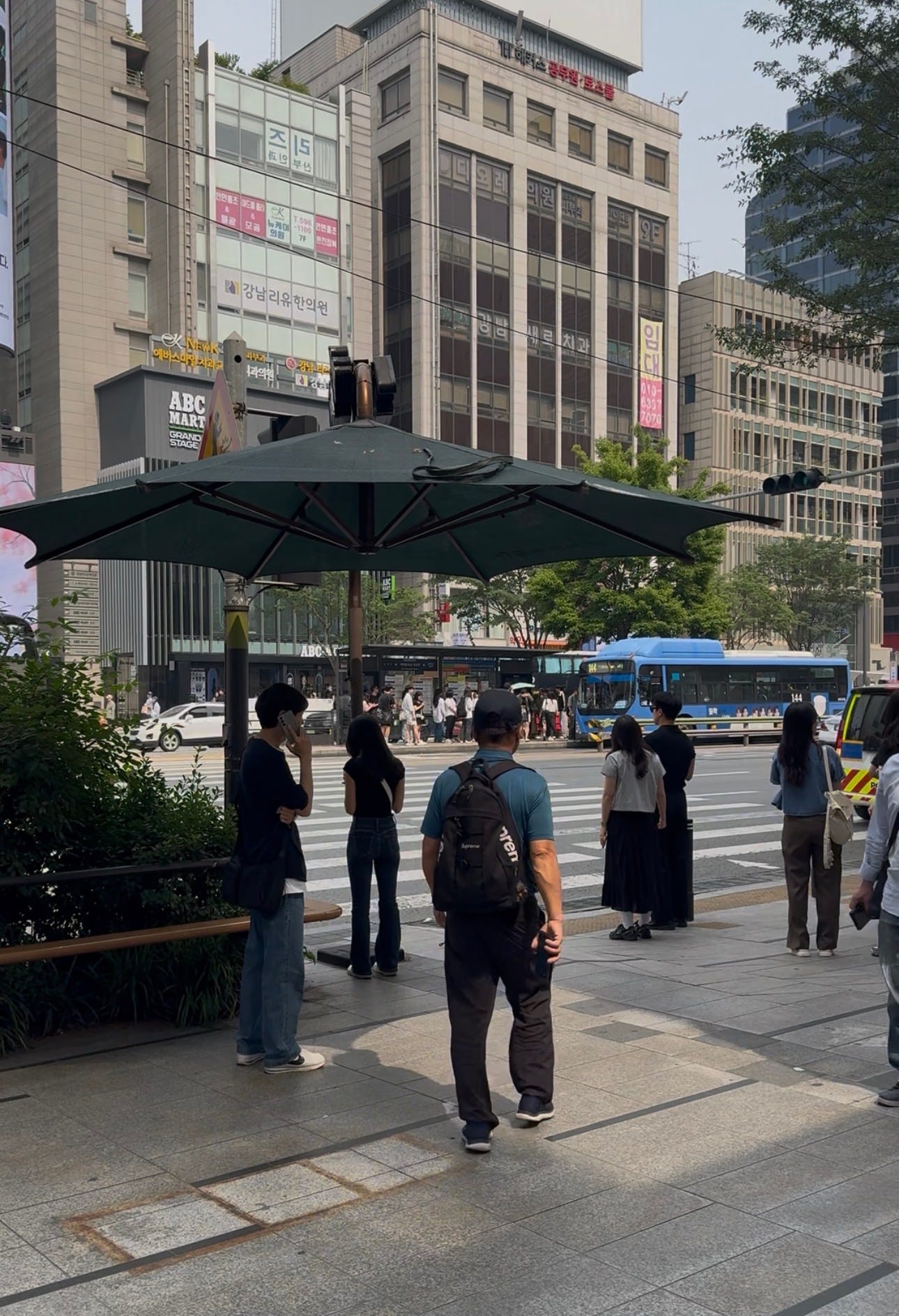 Many crosswalks had big umbrellas like this that people could stand under rain or shine. Many crosswalks had big umbrellas like this that people could stand under rain or shine.