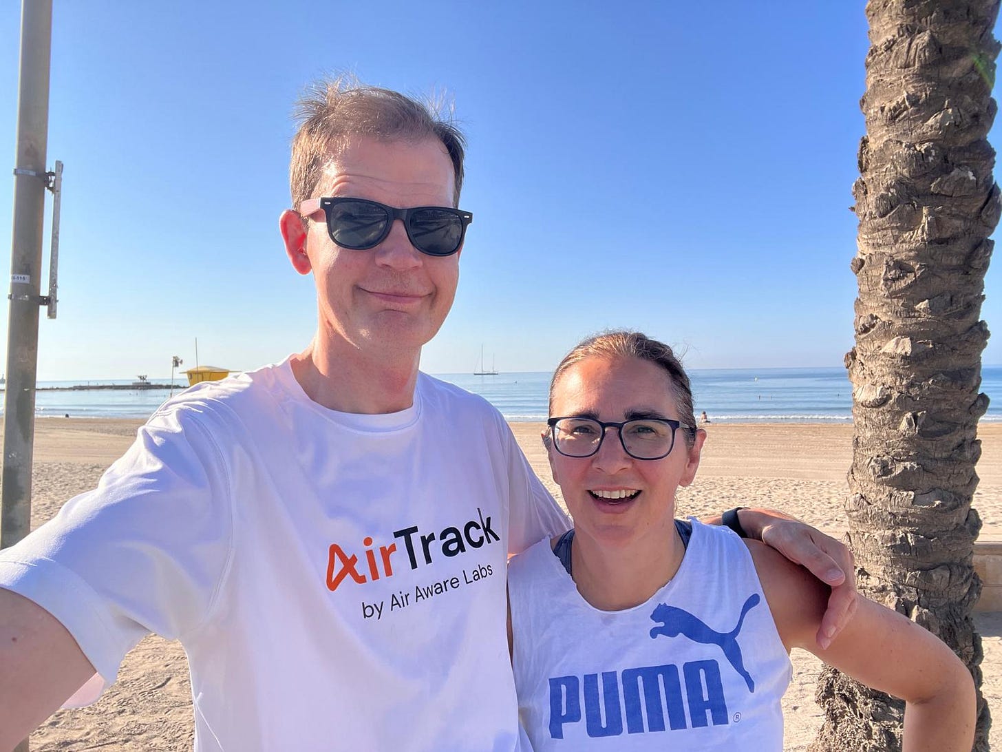 Louise and Sacha mid run at the beach in Vilanova