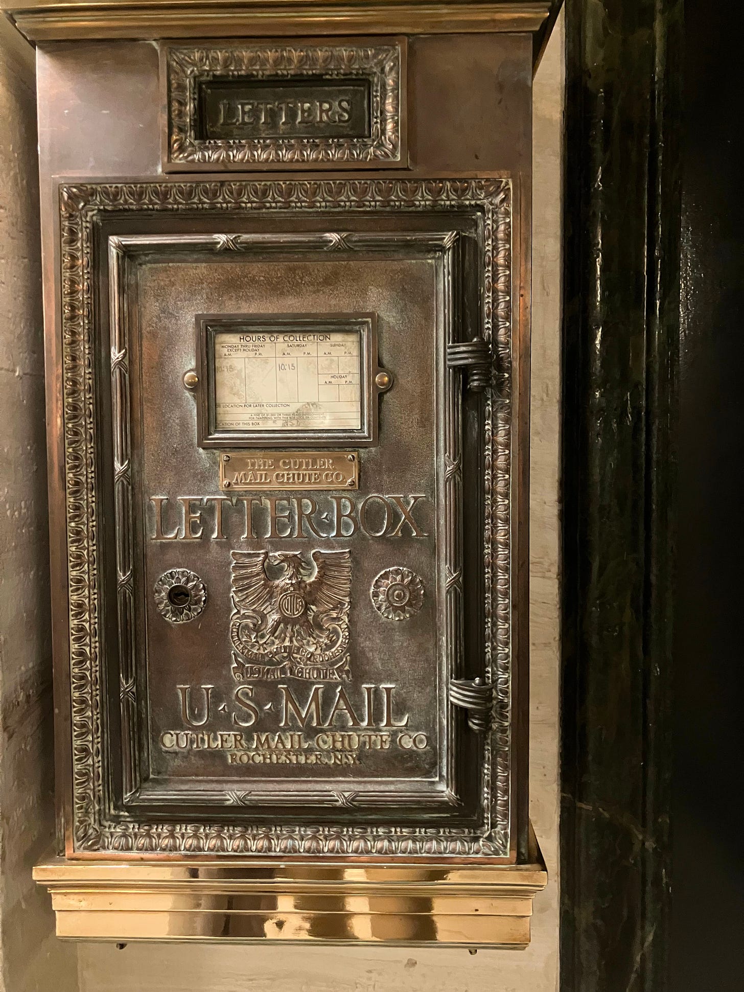 photo of brass U.S. mail chute from a prewar apartment building photo of brass U.S. mail chute from a prewar apartment building