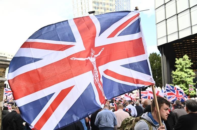 A person holding a flag

AI-generated content may be incorrect.