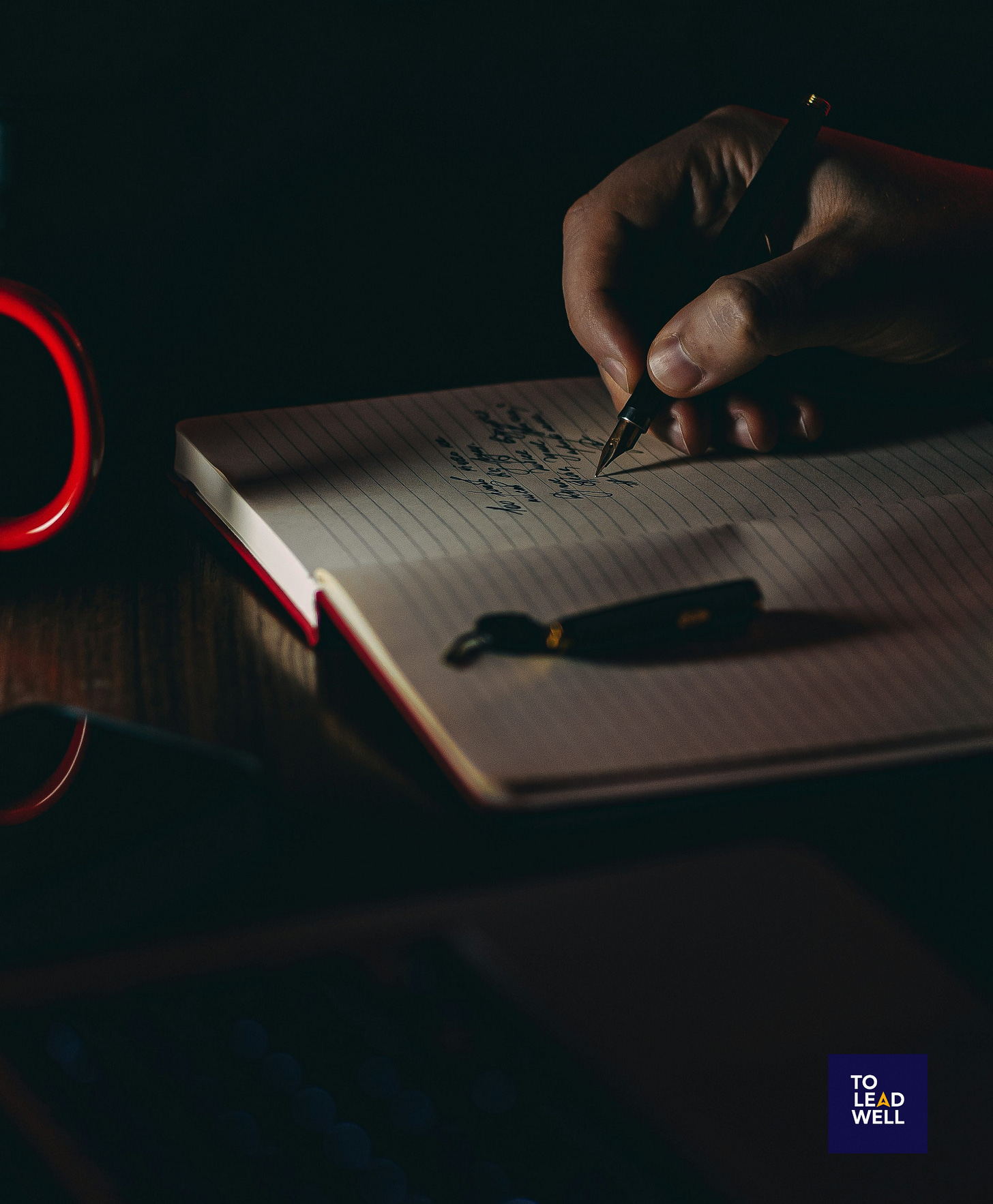 person writing on white paper