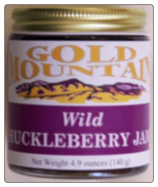 Huckleberry jam in three labels. Huckleberry syrup in Gallone bottles.