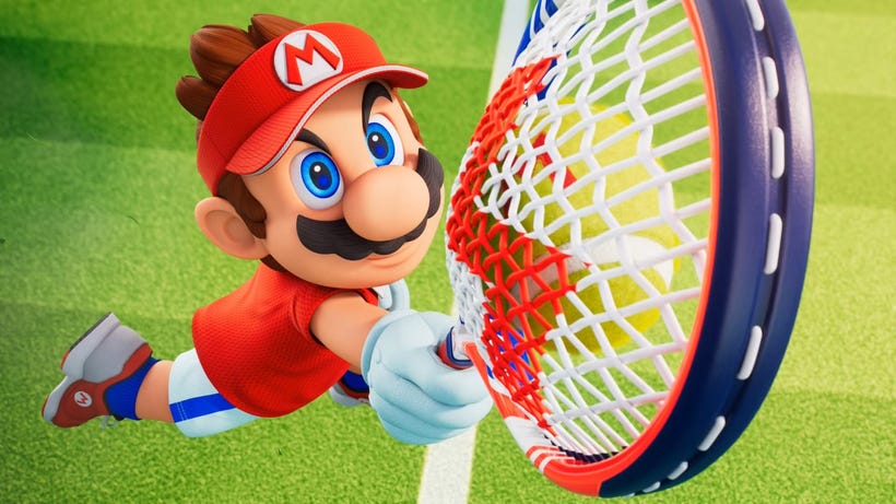 In a cinematic, Mario (wearing tennis clothes) raises a racket to the sky.