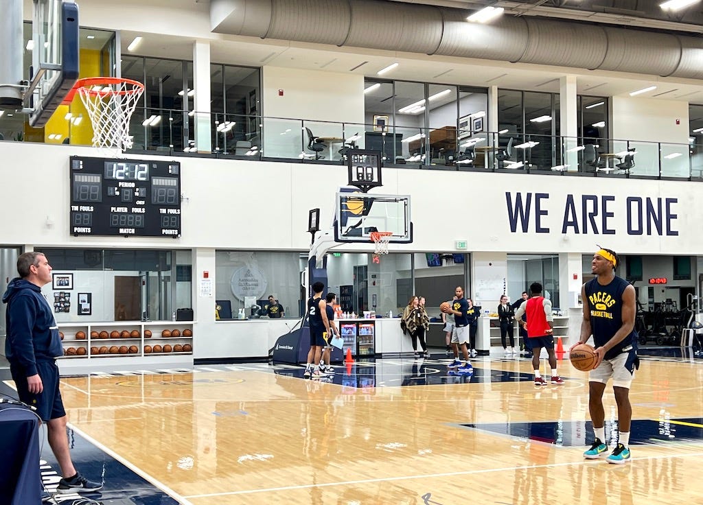 Buddy Hield shoots free throws after practice with assistant coach Mike Weinar.