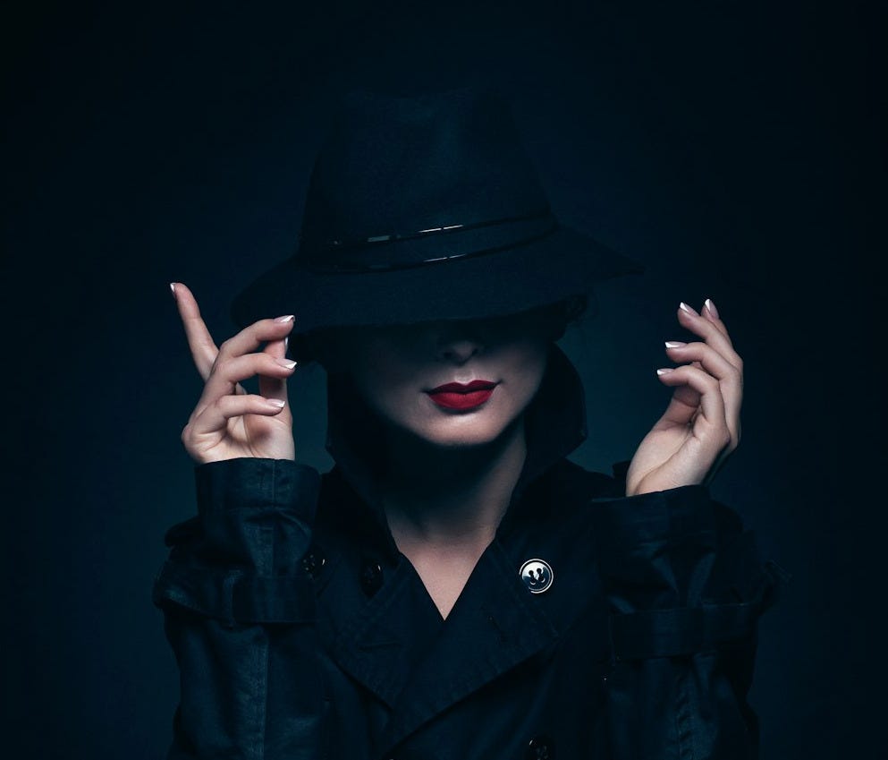 woman in black coat and hat woman in black coat and hat