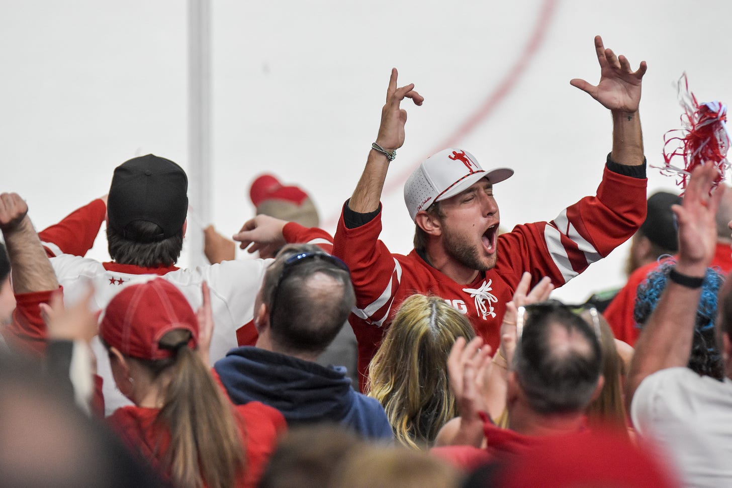 Screaming Wisconsin Badger fan celebrates early lead over Denver Pioneers in national championship game. 