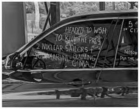 Text on windows of suspect's vehicle