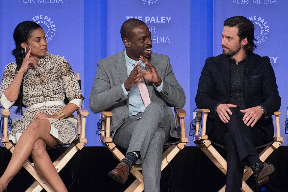 Susan Kelechi Watson, Sterling K. Brown and Milo Ventimiglia sit in chairs during a speaking panel.
