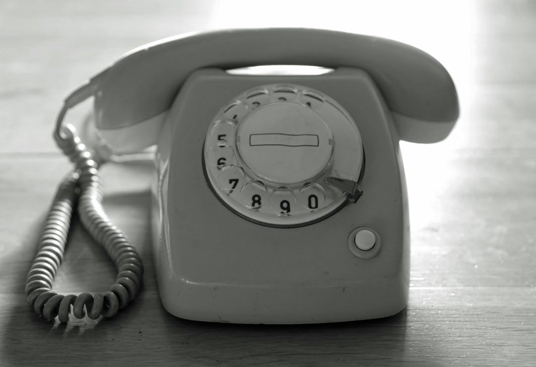 corded phone in greyscale colors