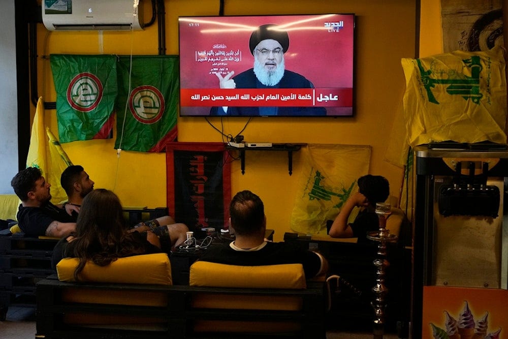 People watch the speech of Hezbollah leader Hassan Nasrallah as they sit in a cafe in the southern suburbs of Beirut, Thursday, Sept. 19, 2024 (AP Photo/Hassan Ammar) People watch the speech of Hezbollah leader Hassan Nasrallah as they sit in a cafe in the southern suburbs of Beirut, Thursday, Sept. 19, 2024 (AP Photo/Hassan Ammar)