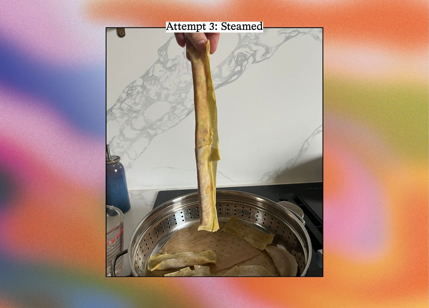 A hand lifts a long, flat steamed dumpling noodle out of a metal steamer basket. Text reads "Attempt 3: Steamed."