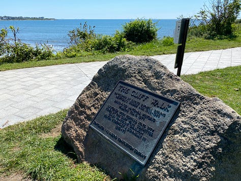 entrance, sign, ocean, trees, brush, railing, clouds
