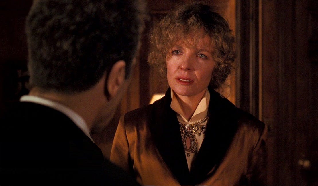 Diane Keaton as Kay Adams Corleone in 'The Godfather: Part III.' She has a curly bangs. Diane Keaton as Kay Adams Corleone in 'The Godfather: Part III.' She has a curly bangs.