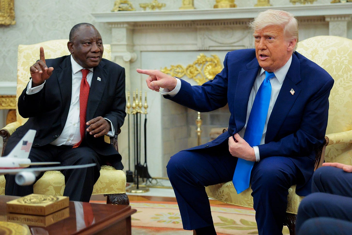 WASHINGTON, DC - MAY 21: U.S. President Donald Trump (R) speaks during a meeting with President of South Africa Cyril Ramaphosa in the Oval Office of the White House on May 21, 2025 in Washington, DC. Relations between the two countries have been strained since Trump signed an executive order in February that claimed white South Africans are the victims of government land confiscation and race-based “genocide” while admitting some of those Afrikaners as refugees to the United States. Trump also halted all foreign aid to South Africa and expelled the country’s Ambassador to the U.S. Ebrahim Rasool. (Photo by Chip Somodevilla/Getty Images)