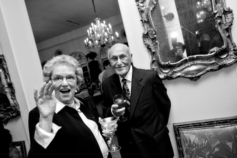 elderly white woman and man in party attire