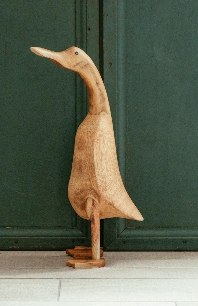 brown wooden duck figurine