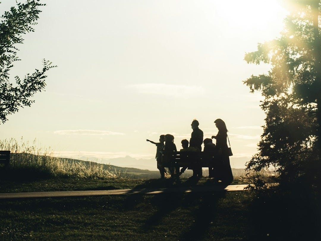 man and woman riding motorcycle on road during daytime